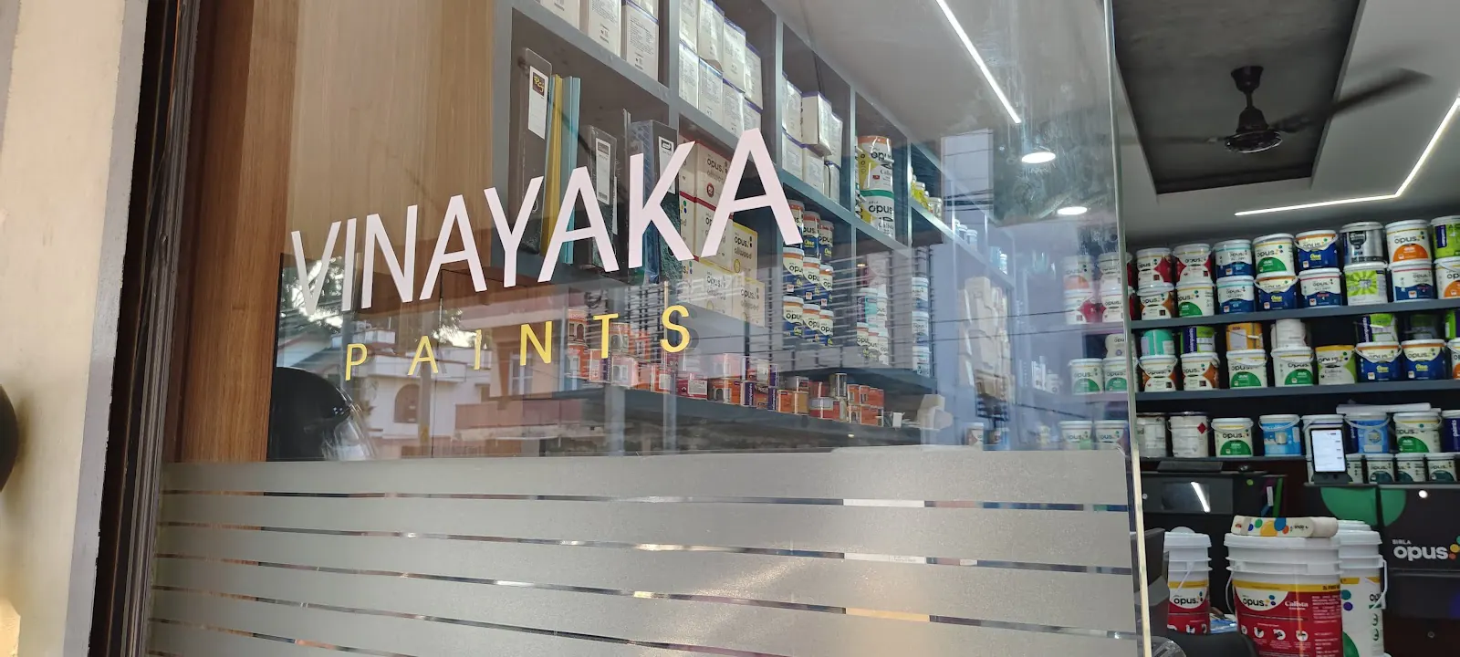 Vinayaka Paints logo on the glass entrance