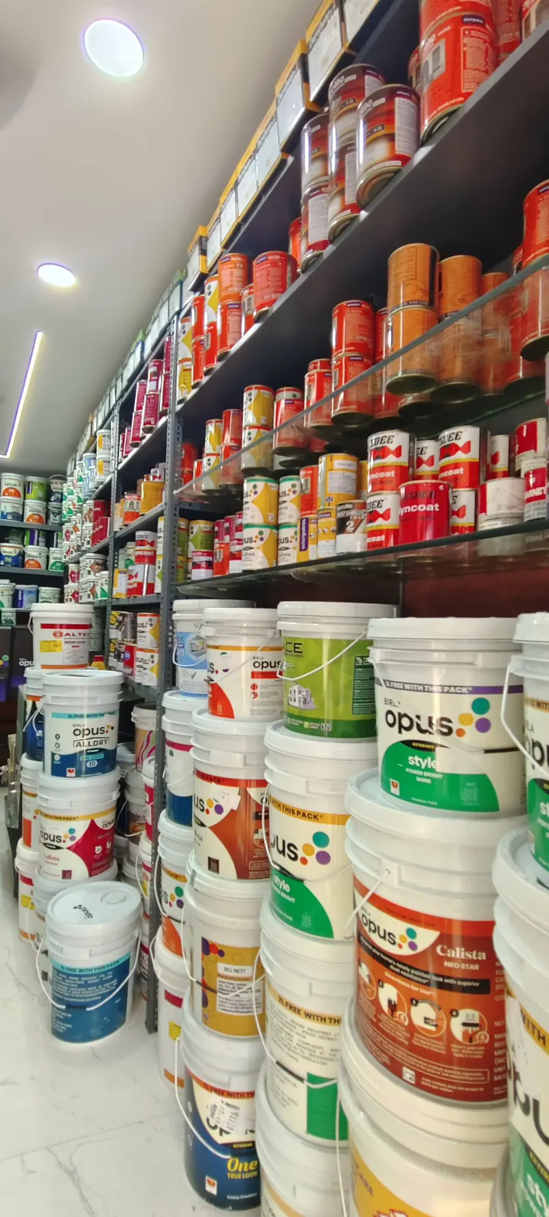 Wall of paint cans in different colours
